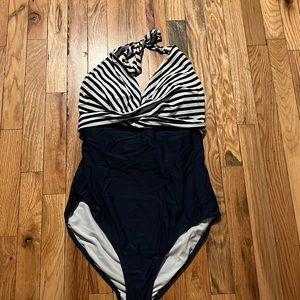 Navy and white bathing suit. Very slimming!